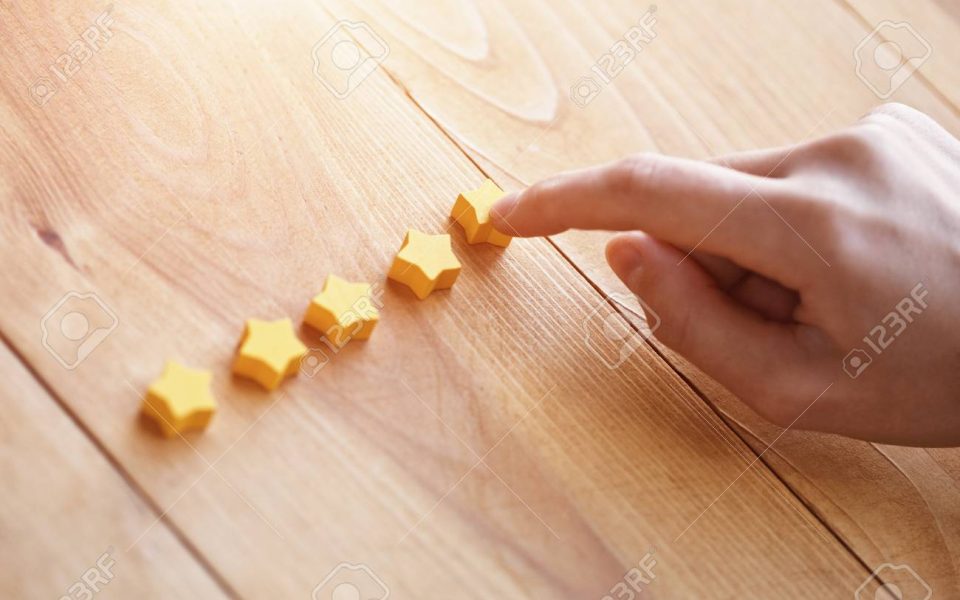 hand gives five stars rating as product feedback hand gives five stars rating as product feedback